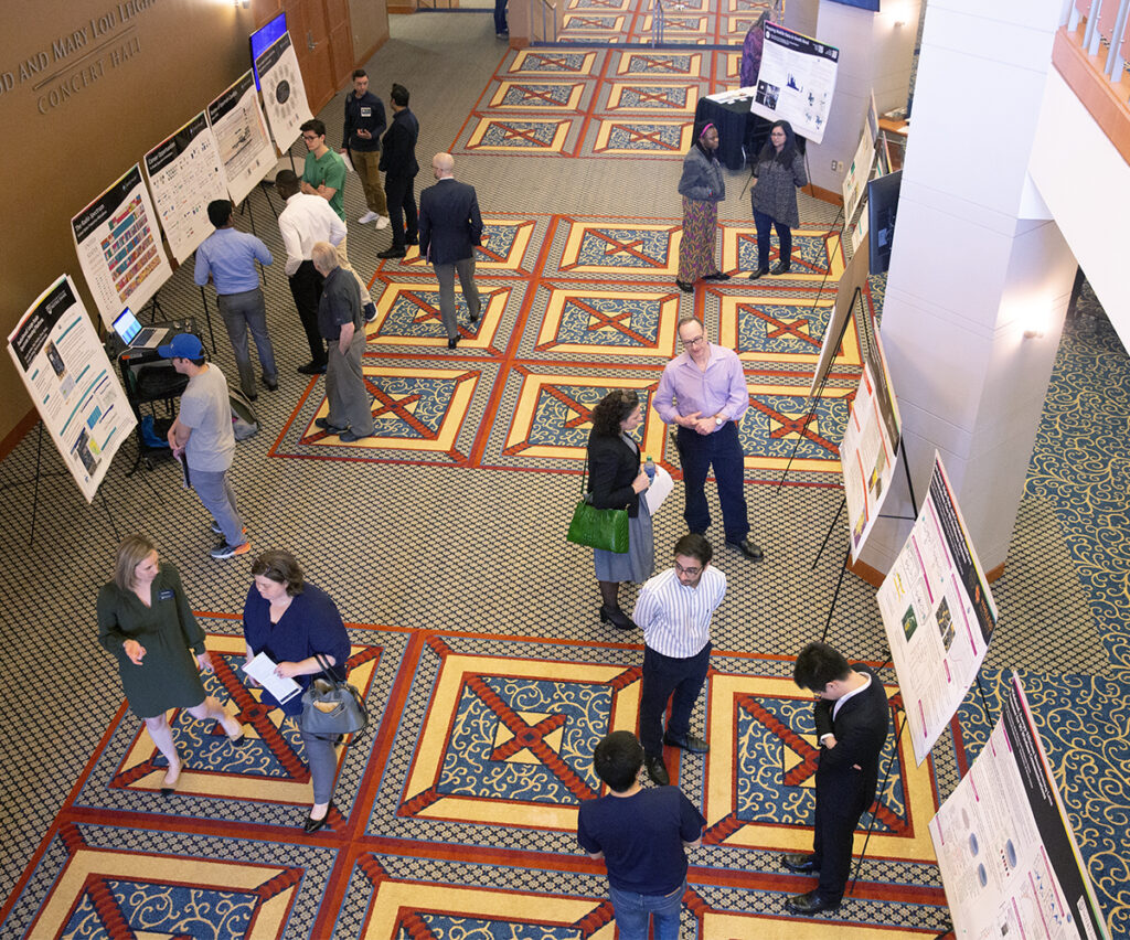 A poster session was held before and after the NTIA Listening Session, giving attendees the ability to discuss research. Photo by Wes Evard, University of Notre Dame.