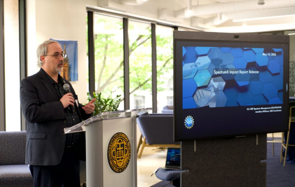 Jonathan Williams (NSF) speaks behind a podium with a microphone